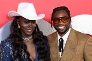 Junelle Bromfield and Noah Lyles at the 2024 GQ Men Of The Year Party (Image via Getty)